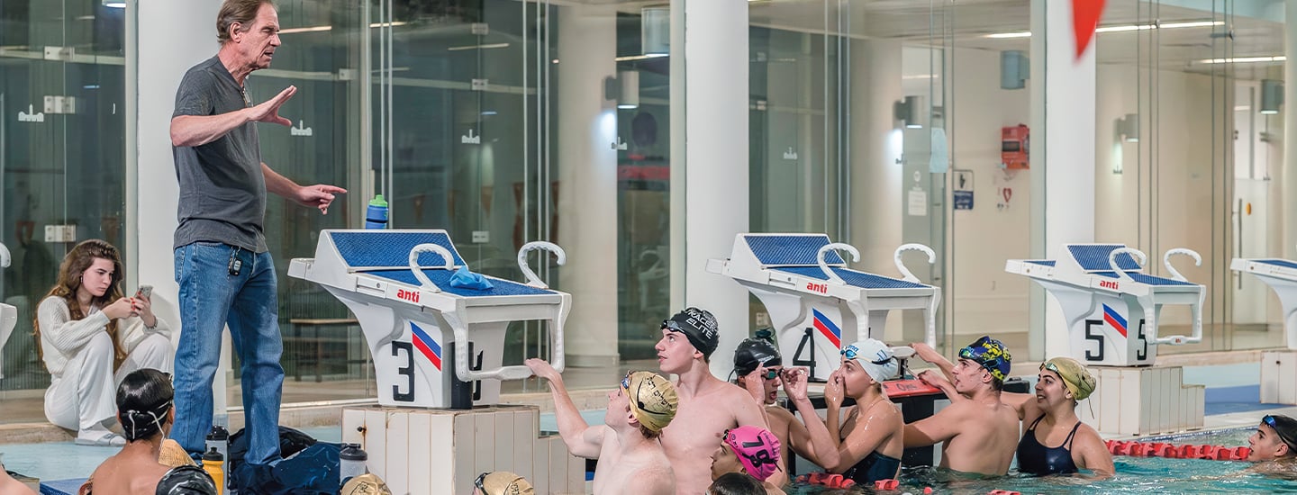 Photo of swimmers practicing in pool