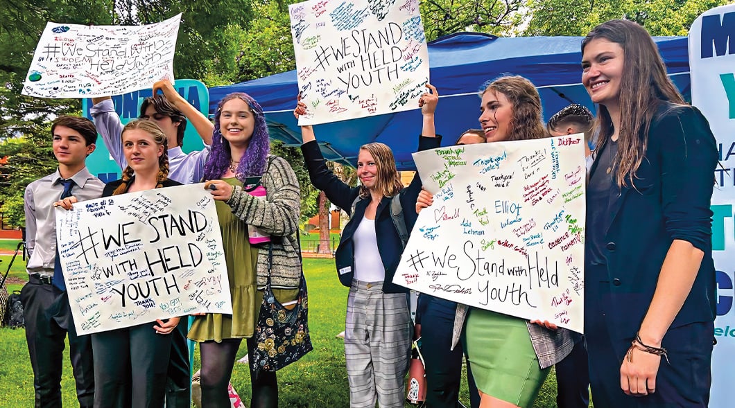 Photo of a group of teens protesting with posters