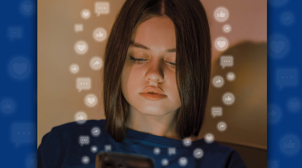 A girl looks at a phone surrounded by floating social media icons